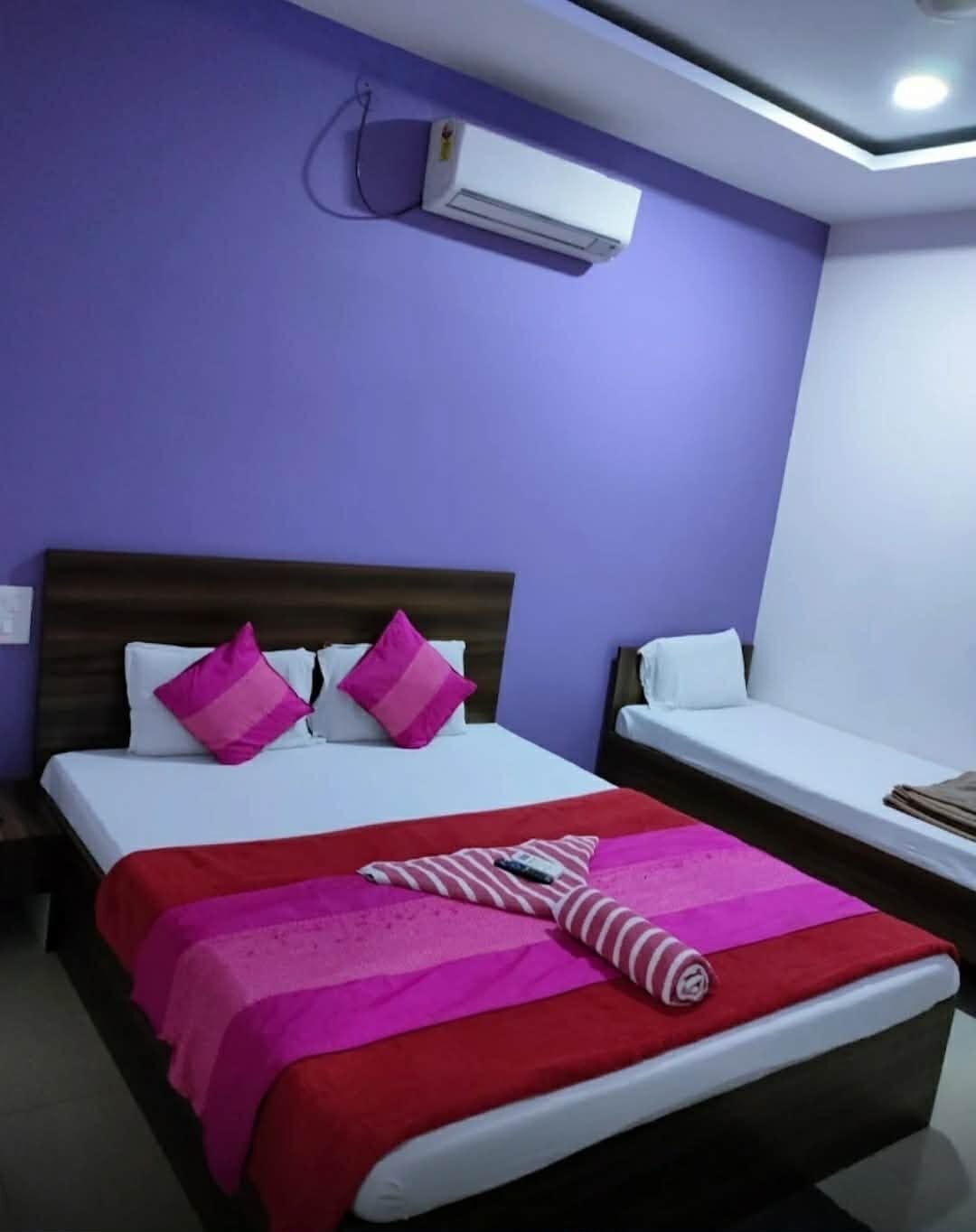 Family room with double and single bed at Yatri Nivas Guest House